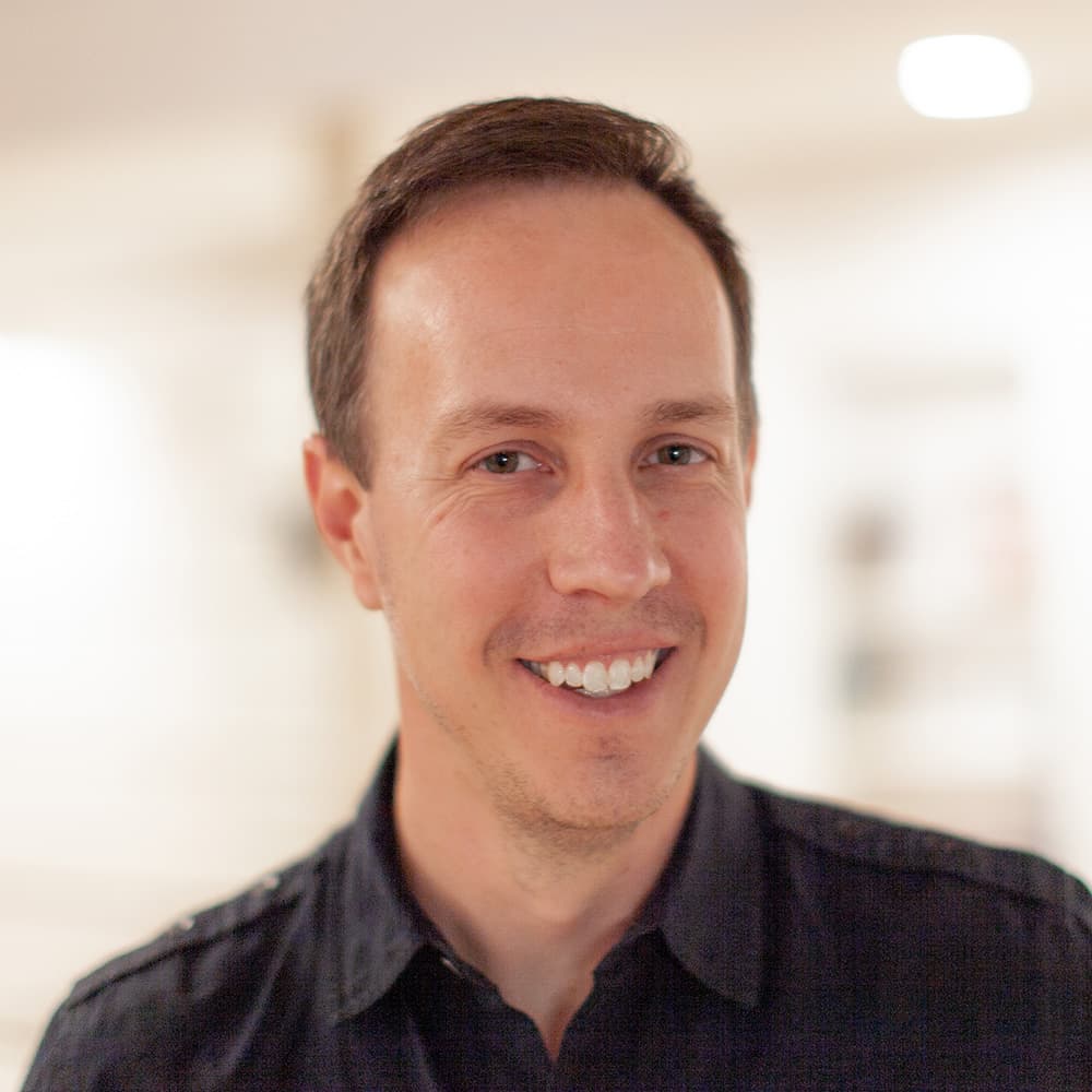 Headshot of Ben Rugg, smiling